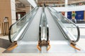 Grodno, Belarus May 20, 2021: View of the escalator in the public shopping center. Moving stairs and escalator railings of a major Royalty Free Stock Photo