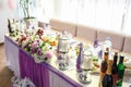 View of the served for decorated wedding dinner table in elite restaurant with beautiful flowers Royalty Free Stock Photo