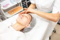 GRODNO, BELARUS - MAY 2018: woman doing facial massage at the beauty salon