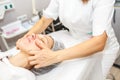 GRODNO, BELARUS - MAY 2018: woman doing facial massage at the beauty salon