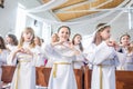 GRODNO, BELARUS - MAY 2019: Young children in the Catholic Church are waiting for the first eucharist communion. Little angels in Royalty Free Stock Photo