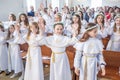 GRODNO, BELARUS - MAY 2019: Young children in the Catholic Church are waiting for the first eucharist communion. Little angels in Royalty Free Stock Photo