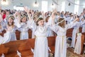 GRODNO, BELARUS - MAY 2019: Young children in the Catholic Church are waiting for the first eucharist communion. Little angels in Royalty Free Stock Photo