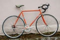 Bicycle repair. Wheel and shiny axle of chrome steel of an old road bike closeup. Retro bike. Red iron fork. Quick Release