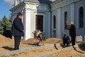 Grodno, Belarus, October 21, 2018: a group of builders engaged in the repair of a Catholic church. Laying a new sidewalk. Chief