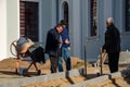 Grodno, Belarus, October 21, 2018: a group of builders engaged in the repair of a Catholic church. Laying a new sidewalk. Chief