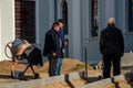 Grodno, Belarus, October 21, 2018: a group of builders engaged in the repair of a Catholic church. Laying a new sidewalk. Chief