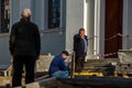 Grodno, Belarus, October 21, 2018: a group of builders engaged in the repair of a Catholic church. Laying a new sidewalk. Chief