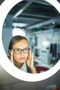 Groggy, young woman yawning in front of her bathroom mirror Royalty Free Stock Photo