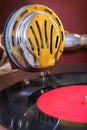 Gromophone speaker on vinyl disk close up Royalty Free Stock Photo