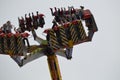 GRONINGEN, NETHERLANDS - MAY 20, 2022: People at pendulum ride attraction in outdoor amusement park