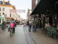 People on bicycle in one of the main shopping streets in dutch town of groningen