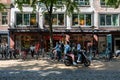 Groningen, The Netherlands, People driving the bike and scooter in the commercial streets of old town