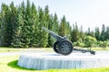 Gronsvik, Norway - August 06, 2019: Side view at artilery gun standing in front of Main building of museum of Gronsvik coastal