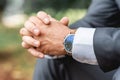 Groom awaiting his bride watching the time pass on clock Royalty Free Stock Photo