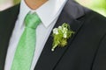 Groom black suit with flower decoration Royalty Free Stock Photo