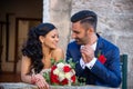 Smiling and happy young married couple leaving church after marriage.Beautiful close-up of young married couple smiling happy. The Royalty Free Stock Photo