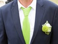 Groom with blue suit and green tie close up Royalty Free Stock Photo