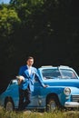 Groom with Bouquet at Cabriolet Royalty Free Stock Photo