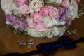 Groom bow tie with bride`s bouquet Royalty Free Stock Photo