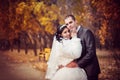 Groom and the bride in autumn park Royalty Free Stock Photo