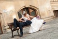 Groom and bride on bench Royalty Free Stock Photo