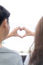 Groom and bride coordinate their hand together for create HEART shape with the clear sky Royalty Free Stock Photo