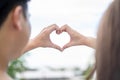 Groom and bride coordinate their hand together for create HEART shape with the clear sky Royalty Free Stock Photo