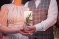 Groom and the bride hold candle in their hands Royalty Free Stock Photo