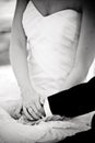 Groom and Bride hold hands at a wedding