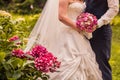 Groom and bride holding bridal bouquet close up Royalty Free Stock Photo
