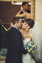 Groom and bride is hugging on the background miror Royalty Free Stock Photo