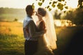 Groom and bride is kissing on the background lake and forest Royalty Free Stock Photo