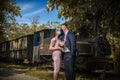 Groom and bride kissing each other in protective medical masks on face in Royalty Free Stock Photo