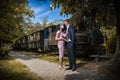 Groom and bride kissing each other in protective medical masks on face in Royalty Free Stock Photo