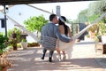 Groom bride kissing sitting in a hammock rope Royalty Free Stock Photo