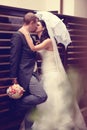 Groom and bride kissing on their wedding day Royalty Free Stock Photo