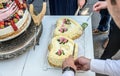 Groom and bride marriage Cutting the delicious fruity Wedding Cake together colorful fruits Royalty Free Stock Photo