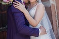 Groom with bride near ancient building in the city Royalty Free Stock Photo