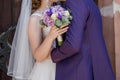 Groom with bride near ancient building in the city Royalty Free Stock Photo