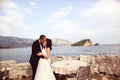 Groom and bride near the sea Royalty Free Stock Photo