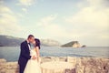 Groom and bride near the sea Royalty Free Stock Photo