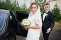 Groom and bride near wedding car Royalty Free Stock Photo