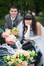 Groom with the bride near the wedding car Royalty Free Stock Photo