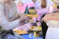 Groom and bride offering tray of gift to older in traditional Thai wedding ceremony. Concept of marriage.