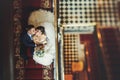 Groom and bride is sitting and kisssing on the stairs Royalty Free Stock Photo