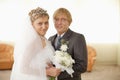 Groom and bride in solemn hall for wedding