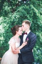 Groom and bride together. couple hugging. Wedding day. Beautiful bride and elegant groom walking after wedding ceremony. Royalty Free Stock Photo