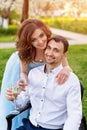 Groom and bride together, wedding couple. Young couple embracing, drinking champagne in blooming spring garden. Love and Royalty Free Stock Photo