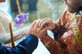 Groom and bride on the wedding engagement ceremony in orthodox church Royalty Free Stock Photo